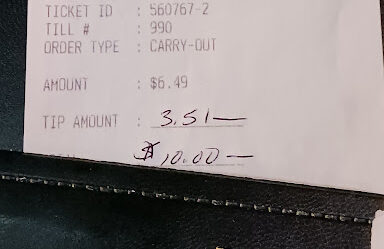 A receipt with a $10 tip.