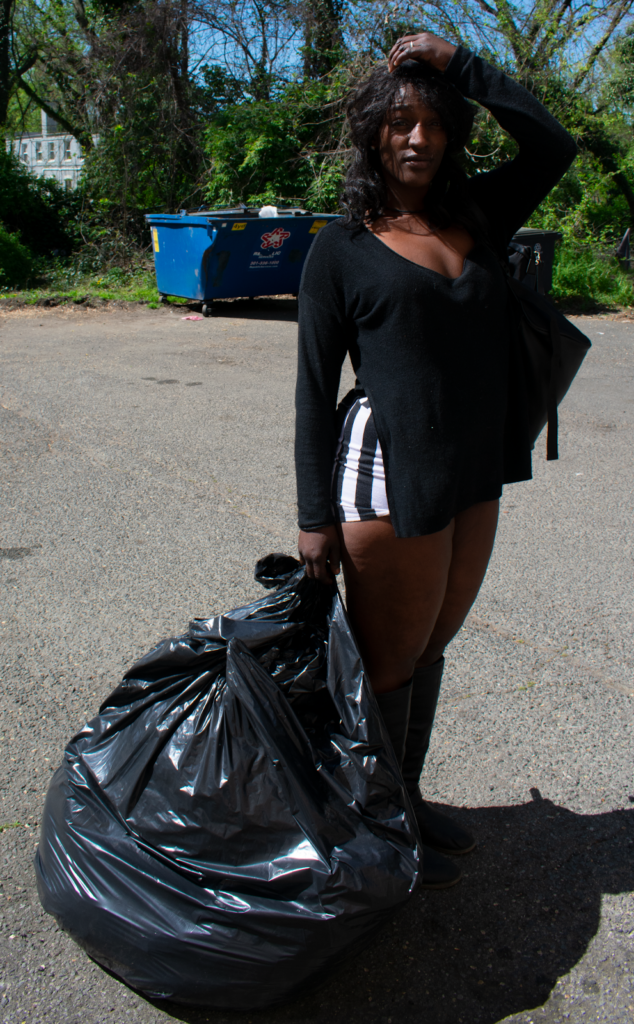 Tavonia Alderman gathered her belongings in a trash bag and left the encampment. Photo by Athiyah Azeem